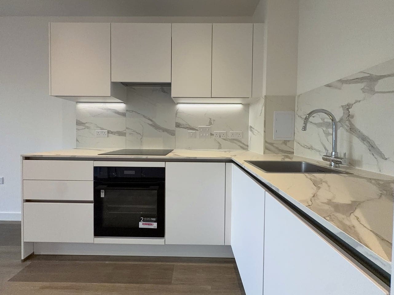 Kitchen with integrated oven and hob